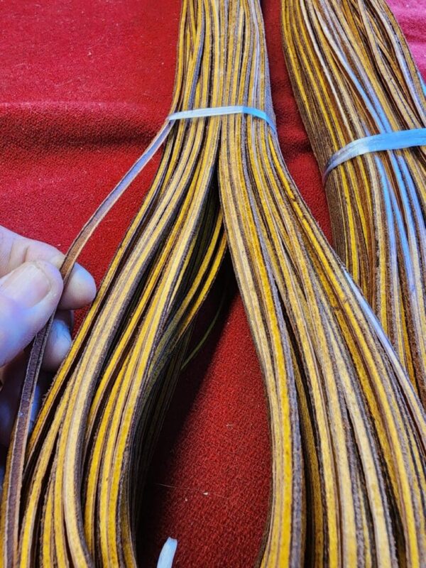 Strips of brown and yellow material bundled together.