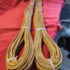 Two bundles of coiled brown rope.