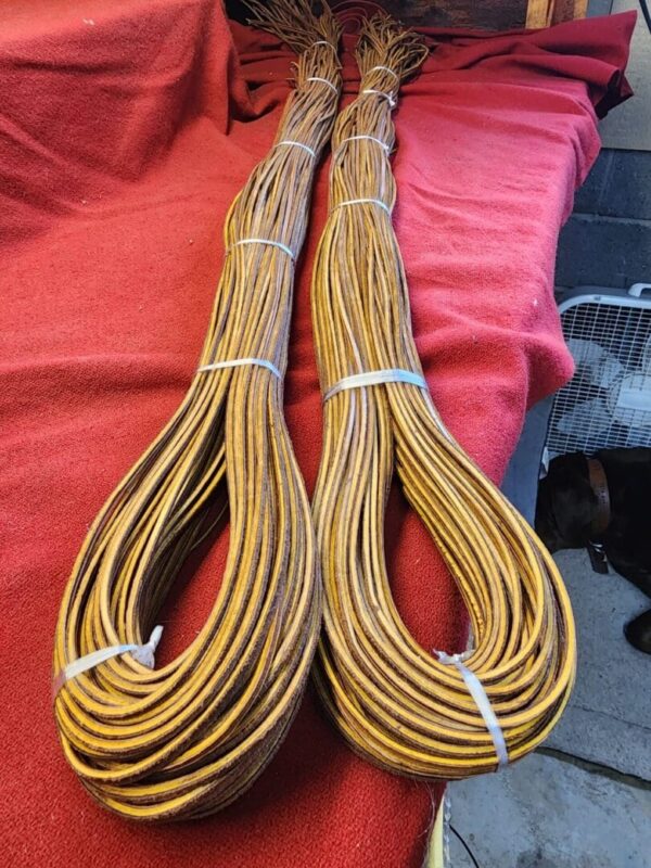 Two bundles of coiled brown rope.