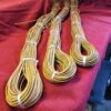 Three bundles of brown and yellow cords.