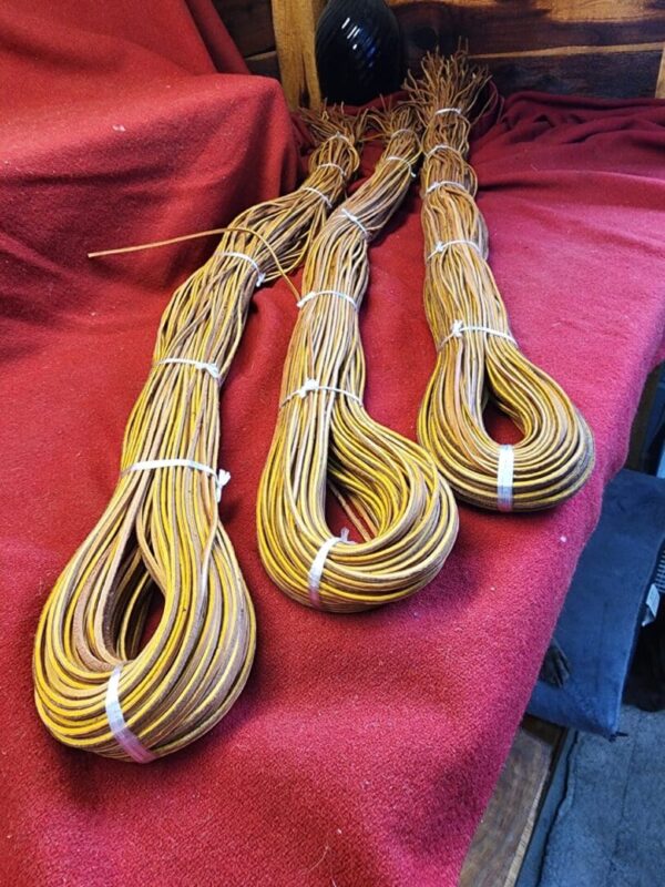 Three bundles of brown and yellow cords.