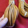 Leather strips neatly bundled together.