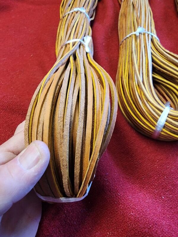 Leather strips neatly bundled together.