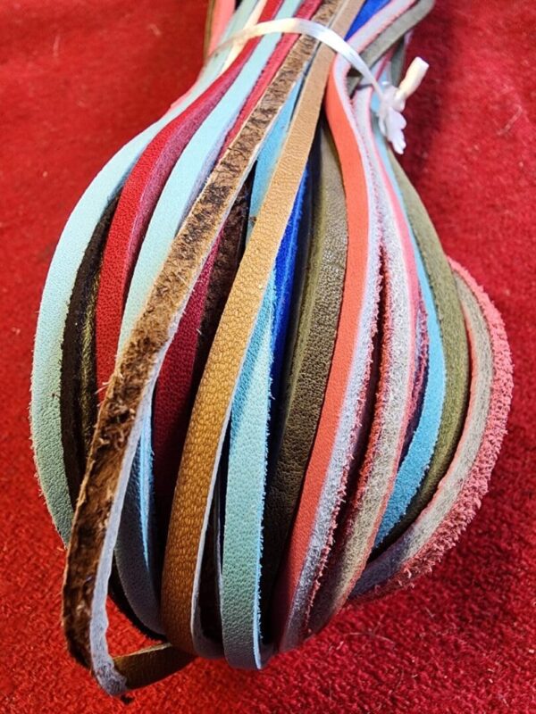 Colorful strips of fabric or leather material.