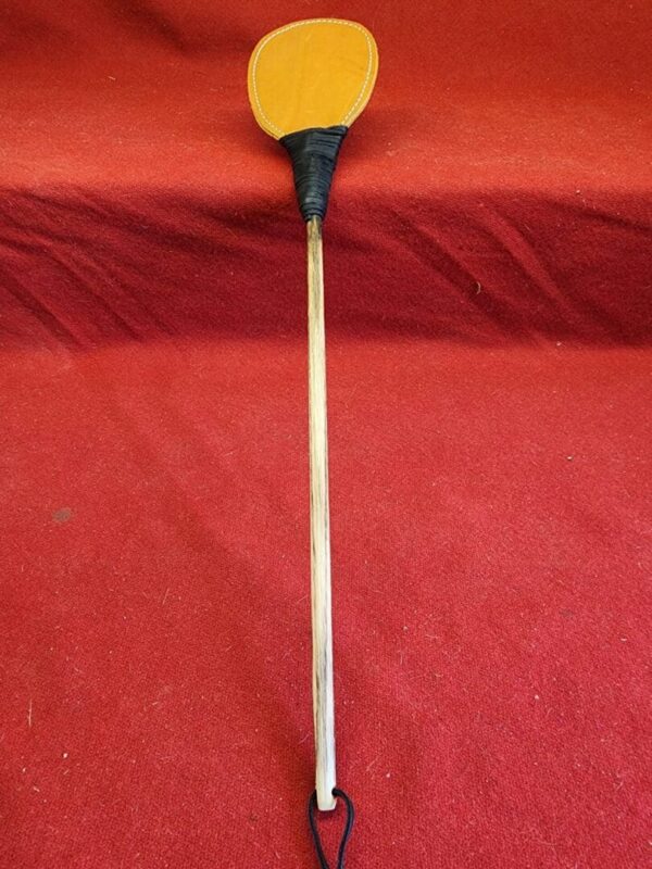20240629_134450 Leather paddle on a wooden handle.