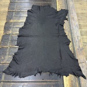 IMG_1941 Black leather hide on wooden table.