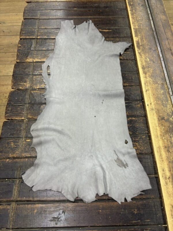 Animal hide on wooden table surface.