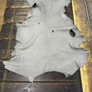 IMG_2004 Gray leather hide on wooden surface.