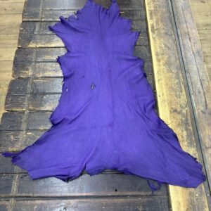 IMG_2040 Purple leather piece on wooden surface.