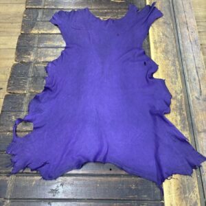 IMG_2044 Purple leather hide on wooden surface.