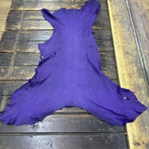 IMG_2051 Purple leather hide on wooden surface.