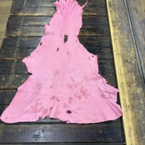 IMG_2059 Pink leather piece on a wooden table.