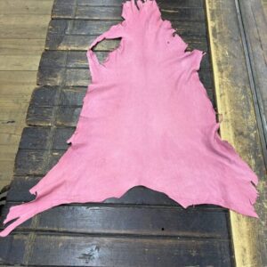IMG_2064 - Copy Pink leather hide on wooden table.