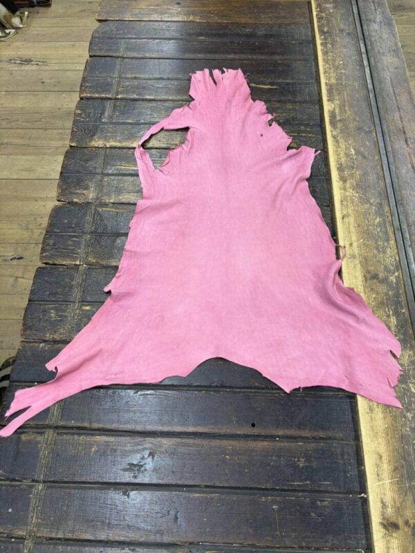 IMG_2064 - Copy Pink leather hide on wooden table.