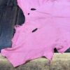 IMG_2070 Pink leather piece with irregular edges.