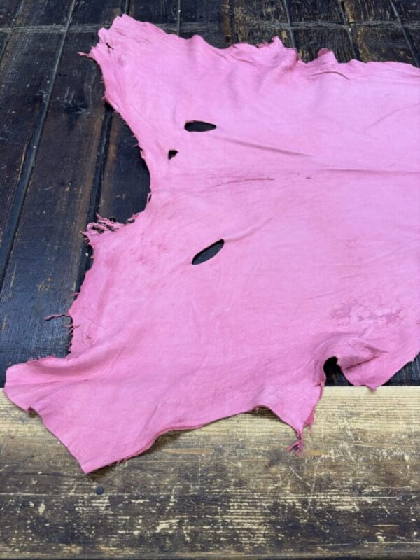 IMG_2070 Pink leather piece with irregular edges.