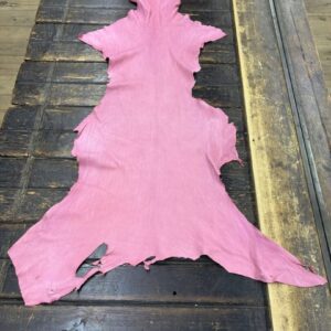 IMG_2073 Pink leather hide on wooden table.