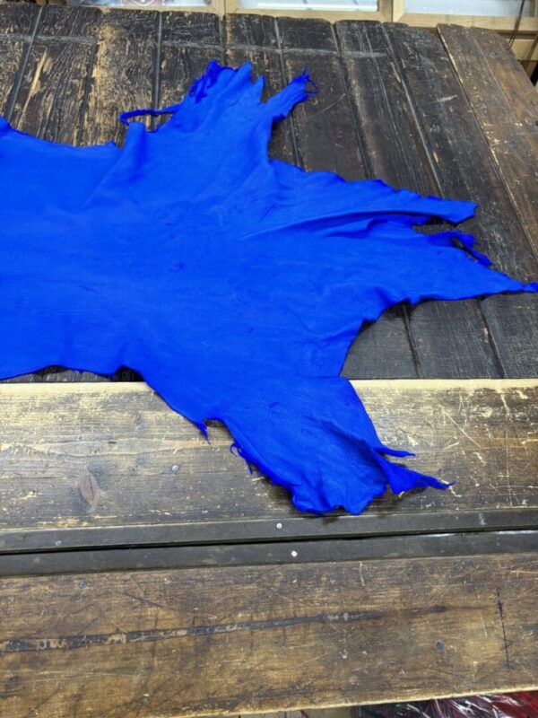 IMG_2082 Bright blue textile on wooden surface.