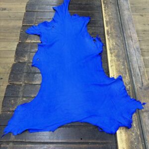 IMG_2088 Bright blue leather hide on wooden surface.