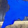 IMG_2093 Blue leather piece on a wooden surface.
