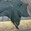Black leather hide on wooden surface.