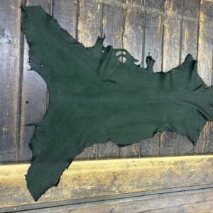 IMG_2110 Green leather hide on a wooden surface.