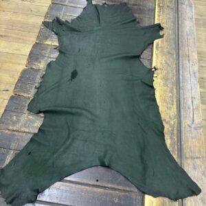 IMG_2118 - Copy Black leather hide on wooden surface.