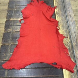 IMG_2126 Red fabric laid on a wooden surface.