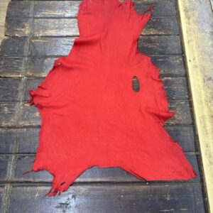 IMG_2134 Red leather hide on wooden surface.
