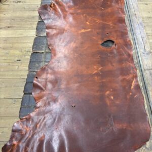 IMG_2429 Brown leather hide on wooden table.