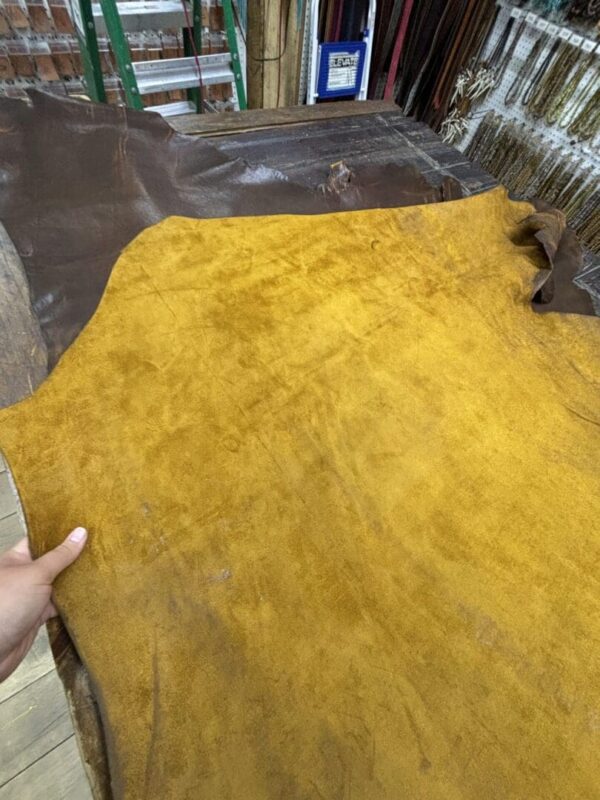 Yellow and brown leather pieces on a table.