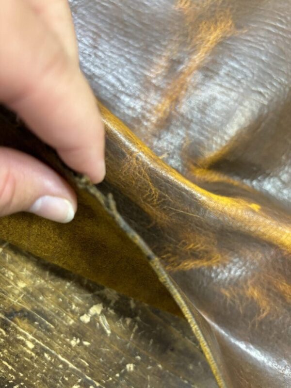 Close-up of textured brown leather fabric.