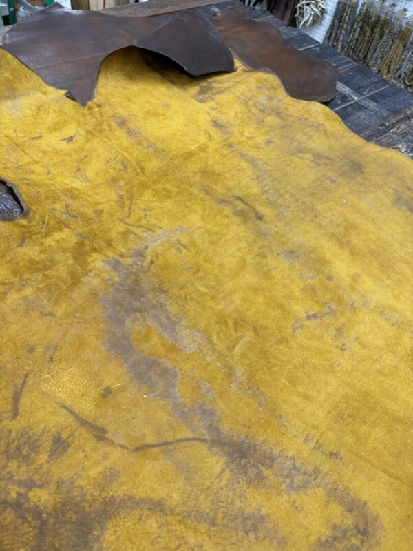 Textured yellow and brown leather materials.