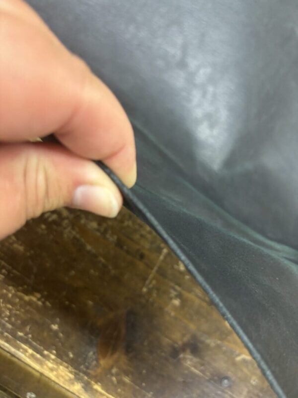 Close up of black leather material.