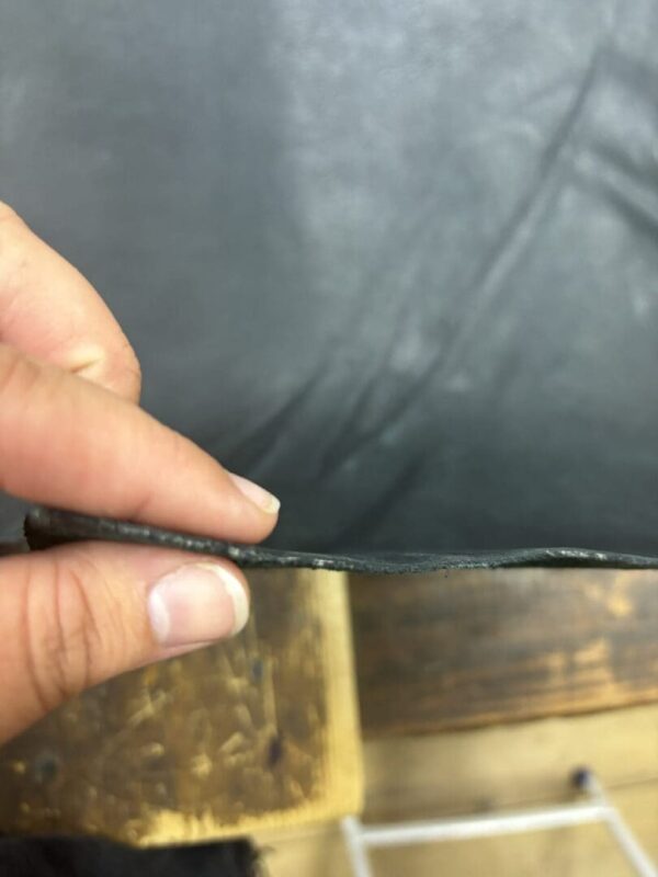 Close-up of black leather material.