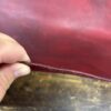 Close up of red leather edge.