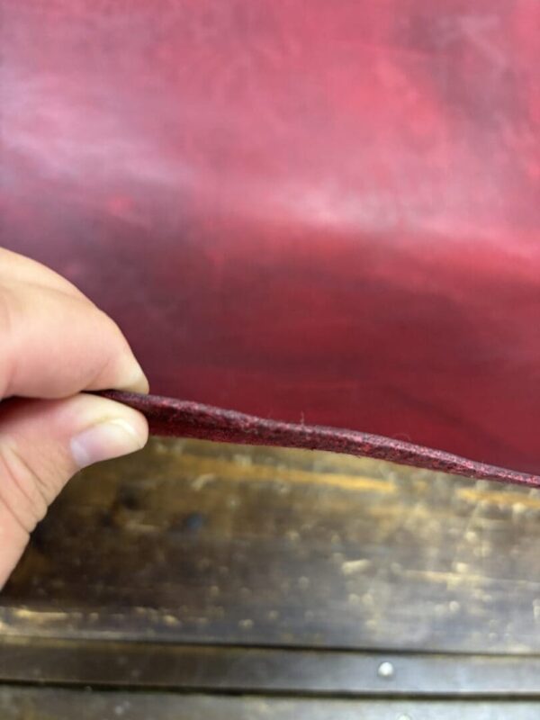 Close up of red leather edge.