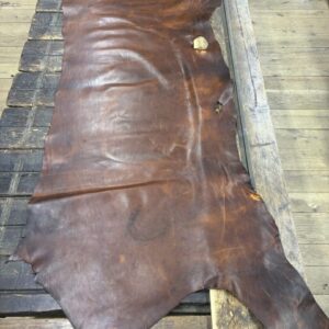 IMG_2654 Brown leather hide on wooden table.