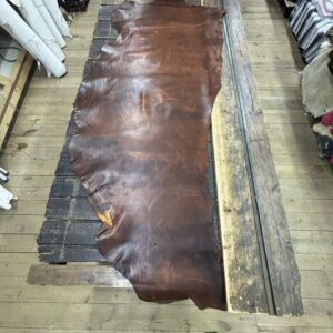 IMG_2661 Large brown leather hide on table.