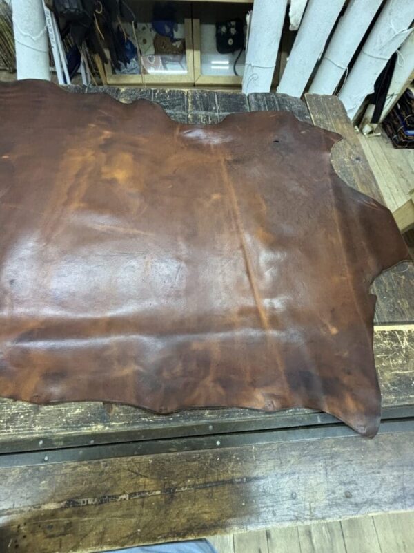 IMG_2663 Brown leather hide on wooden table.