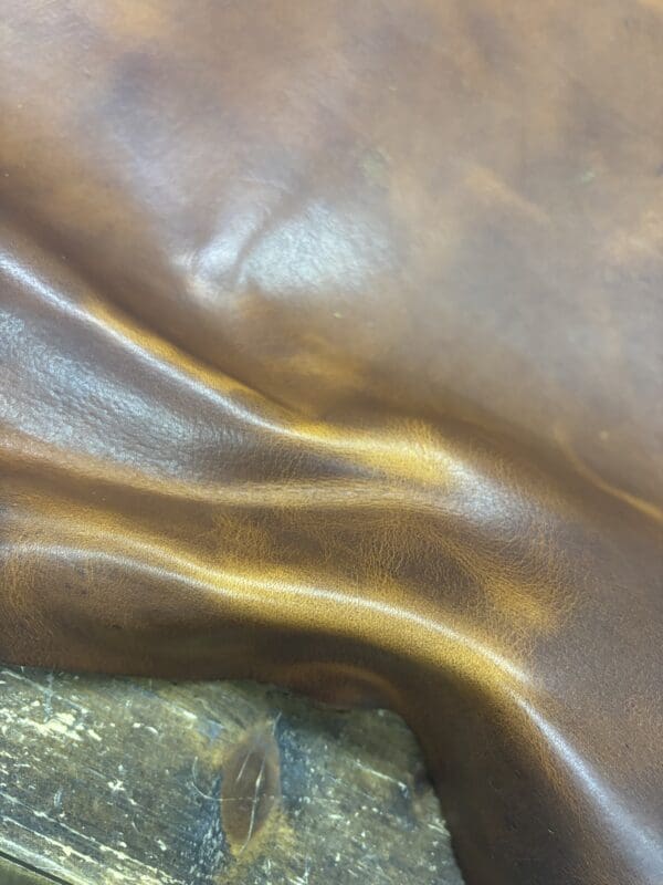 Brown leather texture with folds.