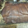 IMG_2670 Brown leather hide on wood table.