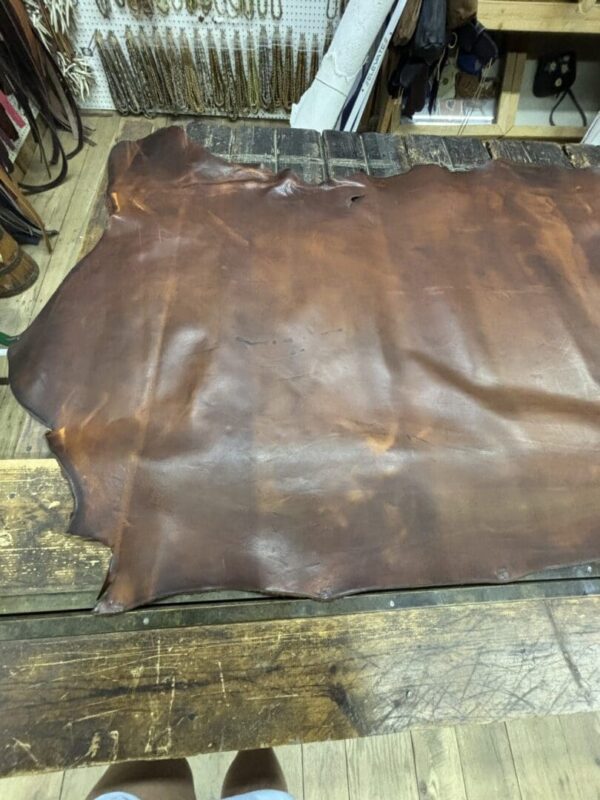 IMG_2670 Brown leather hide on wood table.