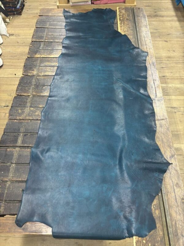 Teal leather on wooden surface.