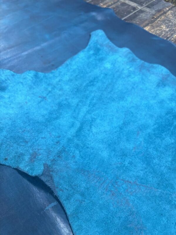 Blue suede leather texture close-up.