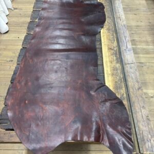 IMG_2710 Large piece of brown leather on wood.