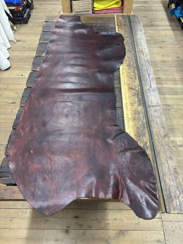 IMG_2710 Large piece of brown leather on wood.