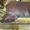 IMG_2711 Brown leather hide on wooden table.
