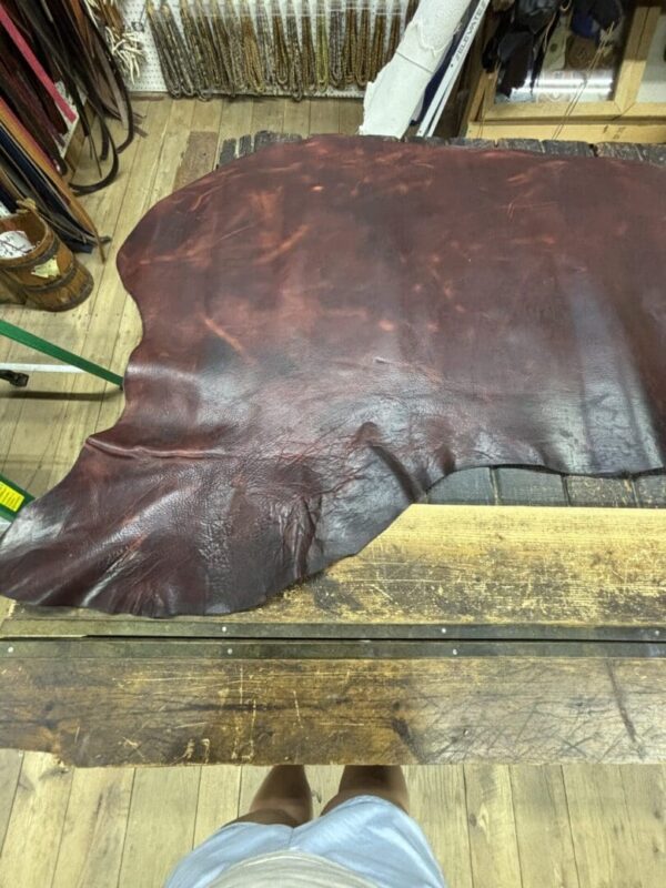 IMG_2711 Brown leather hide on wooden table.