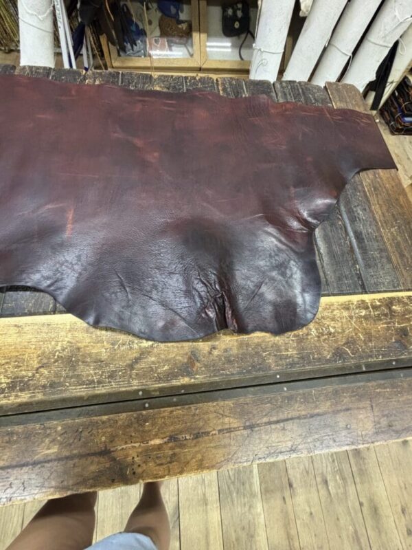 IMG_2712 Brown leather on a wooden table.